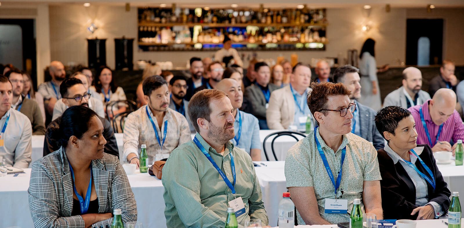 The audience listens attentively to HR leaders discussing the latest talent trends on stage at the 2025 edition of #AvatureUpfront APAC.