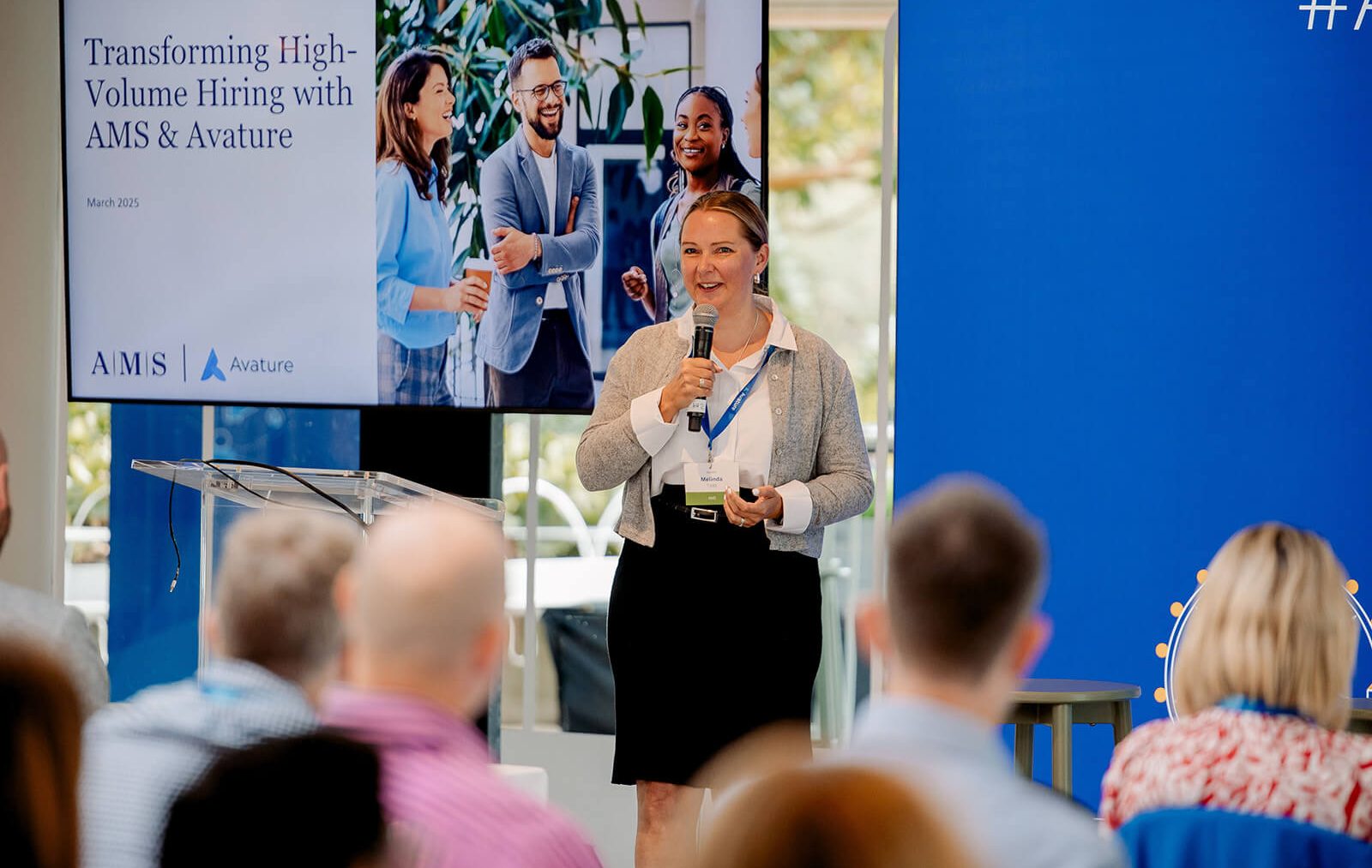 Melinda Todd, Senior Manager of Talent Advisory Consulting at AMS addresses the audience on how to achieve success in high volume hiring.